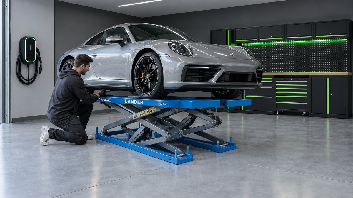Wide view of a modern domestic garage interior featuring a Lander ProLift S55 low-profile scissor lift with a vehicle